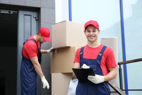 Professional moving team handling furniture near Dollishill