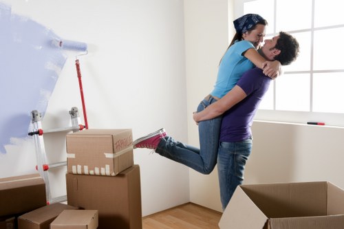Professional movers handling household items in a Dollishill property