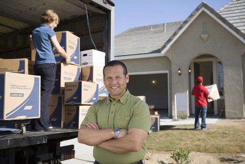 Local moving team handling furniture and boxes near Dollishill