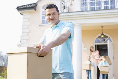 Loading furniture and boxes for removal services in Dollishill