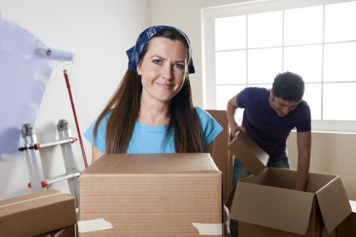 Loading furniture and boxes into a removal van in Dollishill