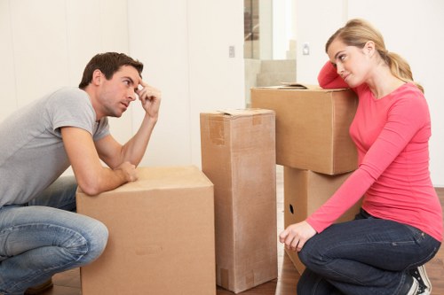 Moving team unloading boxes at a Dollishill home with careful access planning