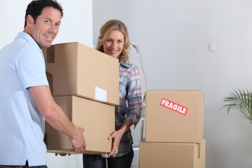 Local removal team handling boxes and furniture in Dollishill